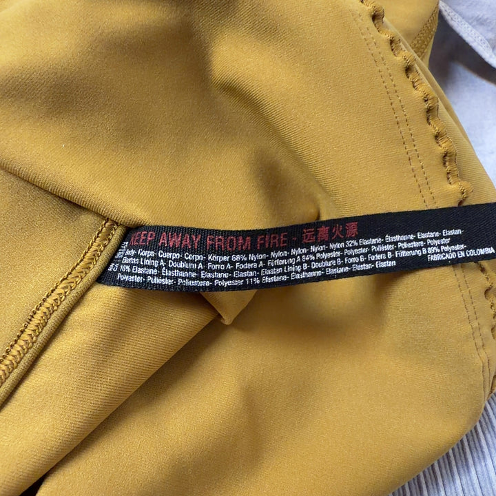 Yellow high-waist bike shorts back view displaying sleek design and comfortable fit