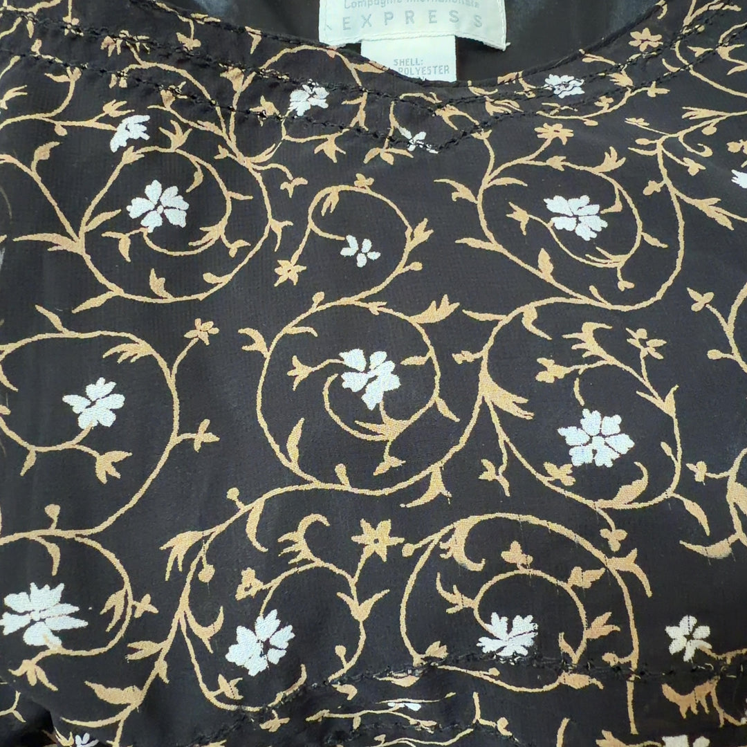 Black floral camisole slip dress with cream and gold print, back view on model