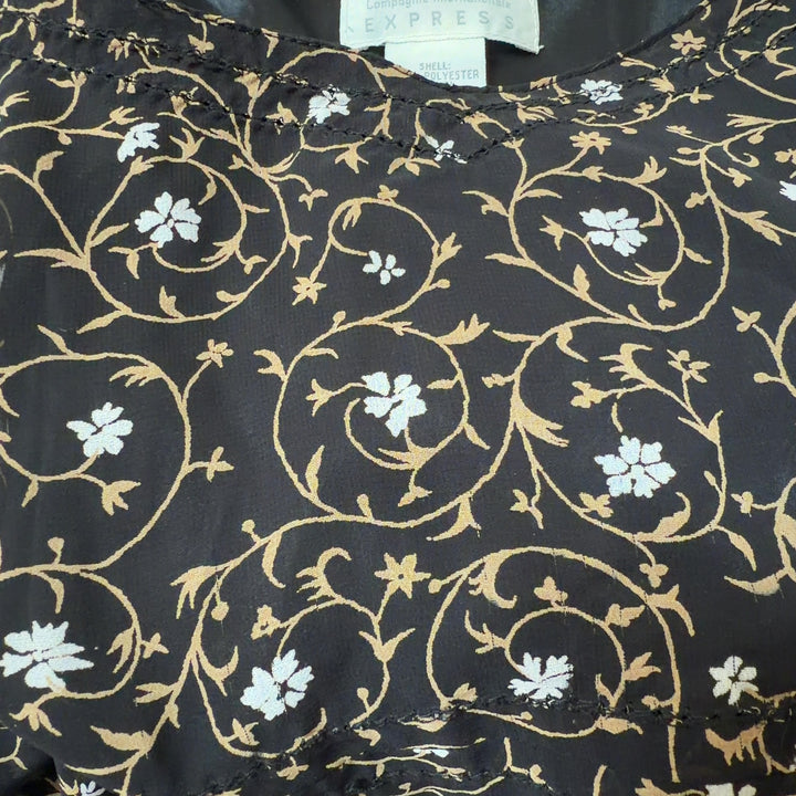 Black floral camisole slip dress with cream and gold print, back view on model