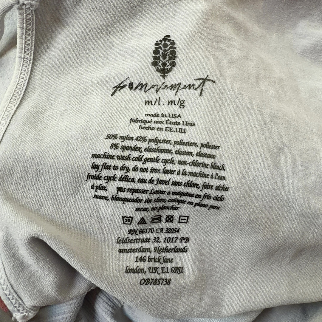 Tag view of cream ribbed tank all-in-one jumpsuit showing fitted silhouette and high-waisted design