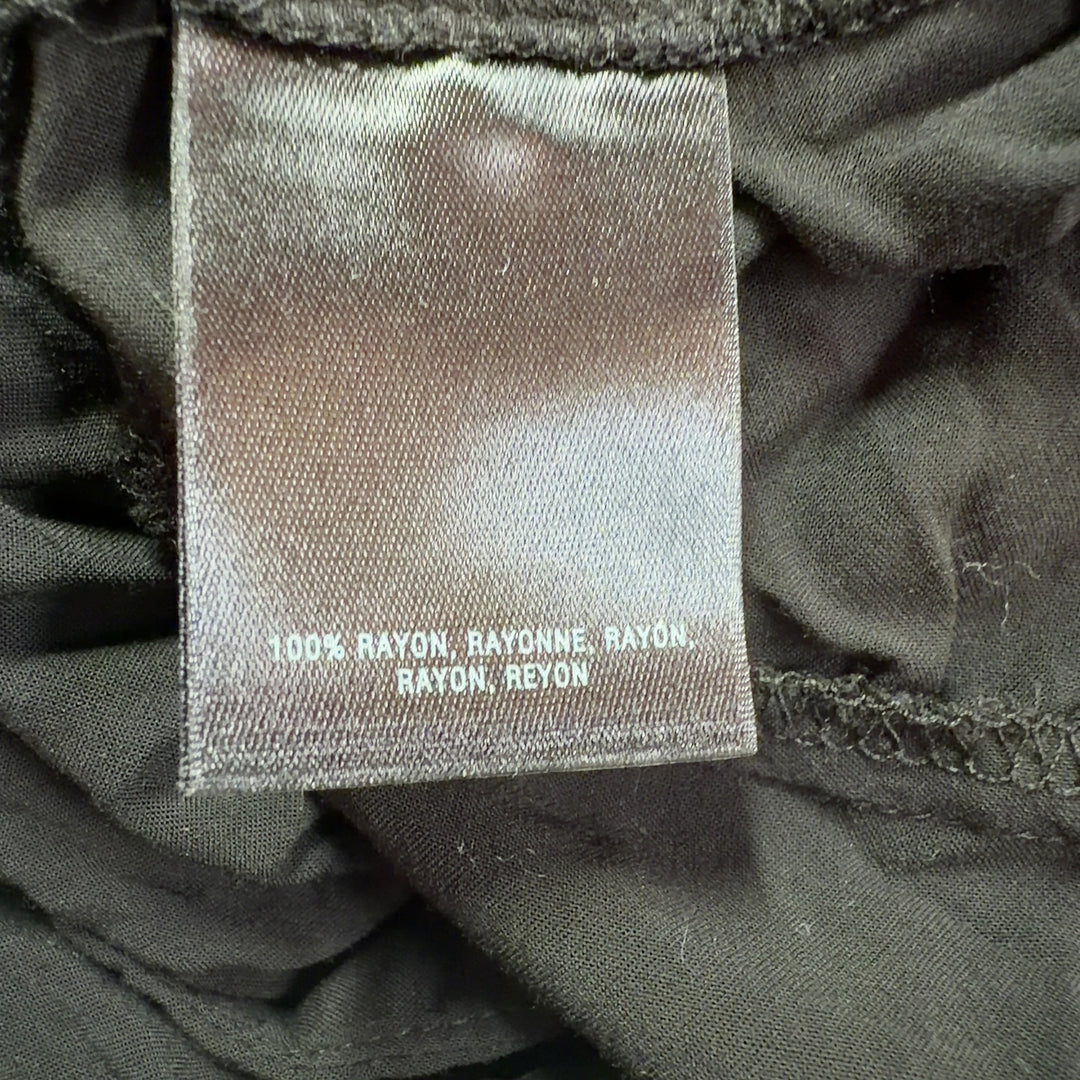 Black rayon button-front pleated blouse back view showing relaxed fit and draping