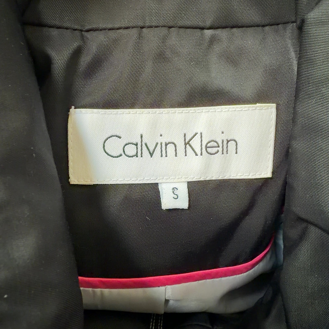 Black Calvin Klein windbreaker coat back view showing sleek silhouette and functional design details