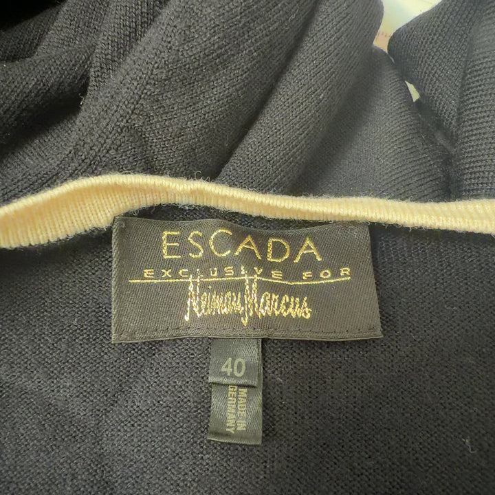 Tag view of black ESCADA wool cardigan with cream trim detailing and three-quarter length sleeves