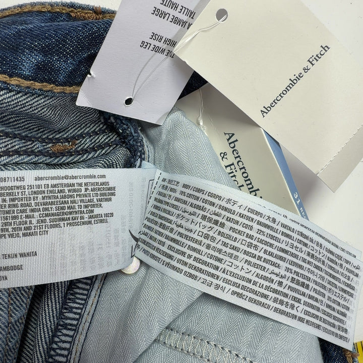 Tag view of blue wide-leg denim jeans showing relaxed fit and classic denim construction