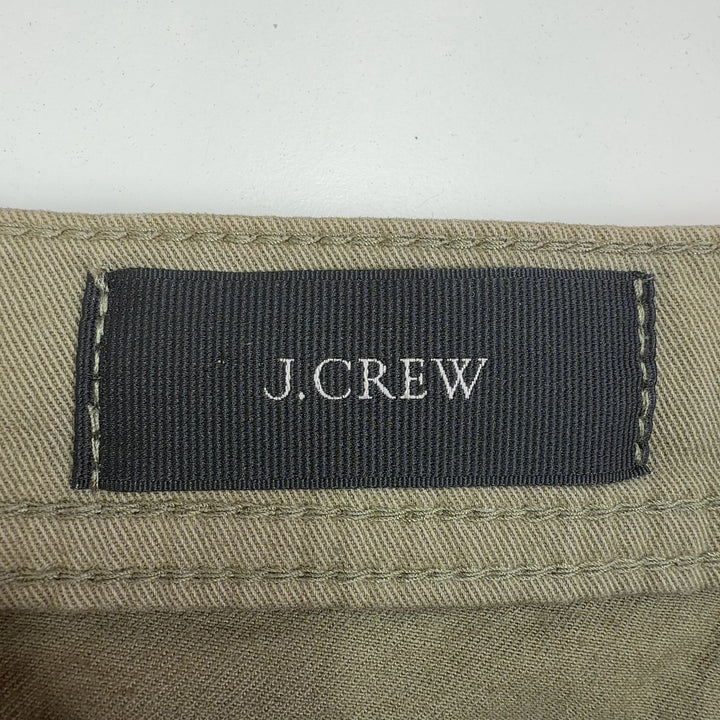 Tag view of olive green cropped cargo pants showing relaxed fit and ankle length