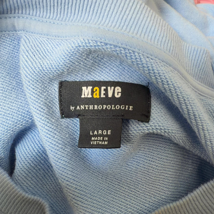 Light blue colorblock chevron sweatshirt with navy and cream geometric stripes, back view