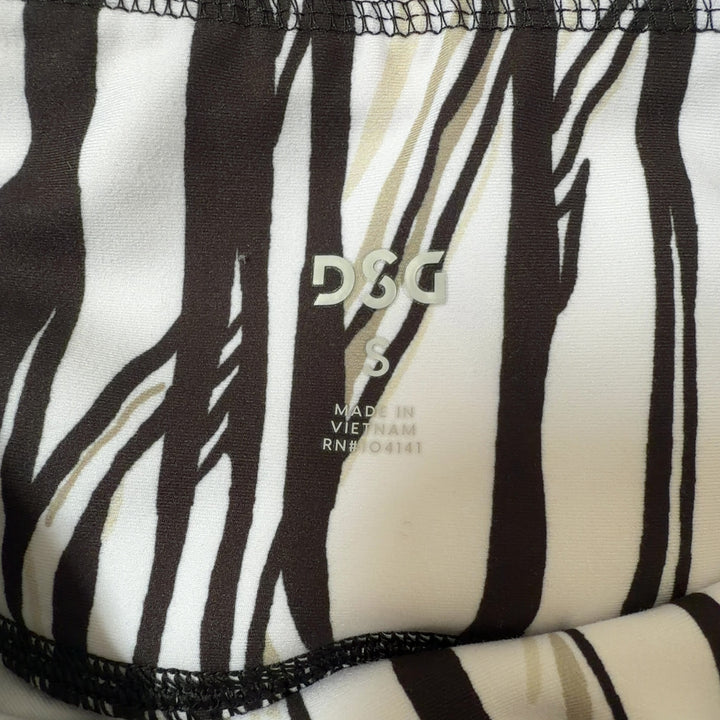 White and black striped DSG capri leggings with high-waisted design, side view