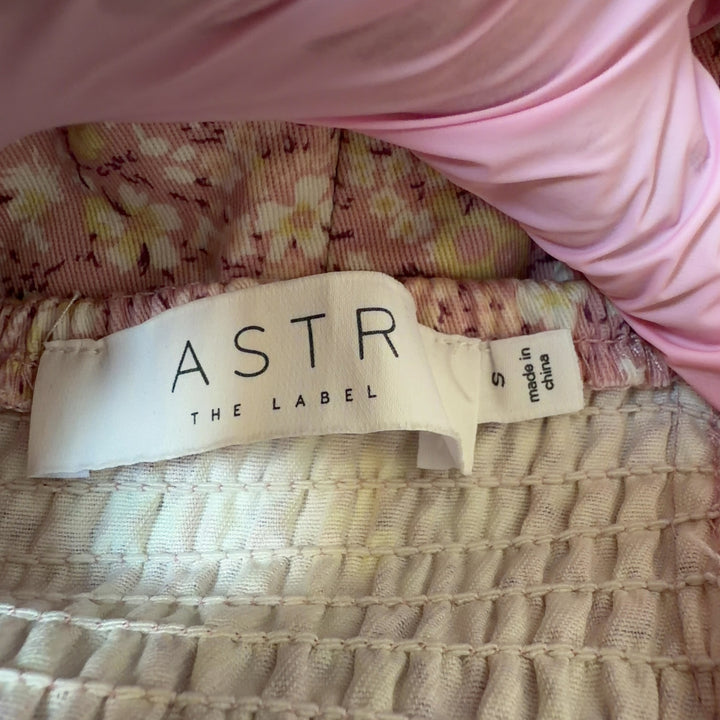 ASTR pink floral mini dress with puff sleeves and side slit, back view