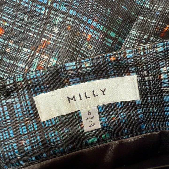 Black plaid pencil skirt back view, showing fitted silhouette and plaid pattern detail
