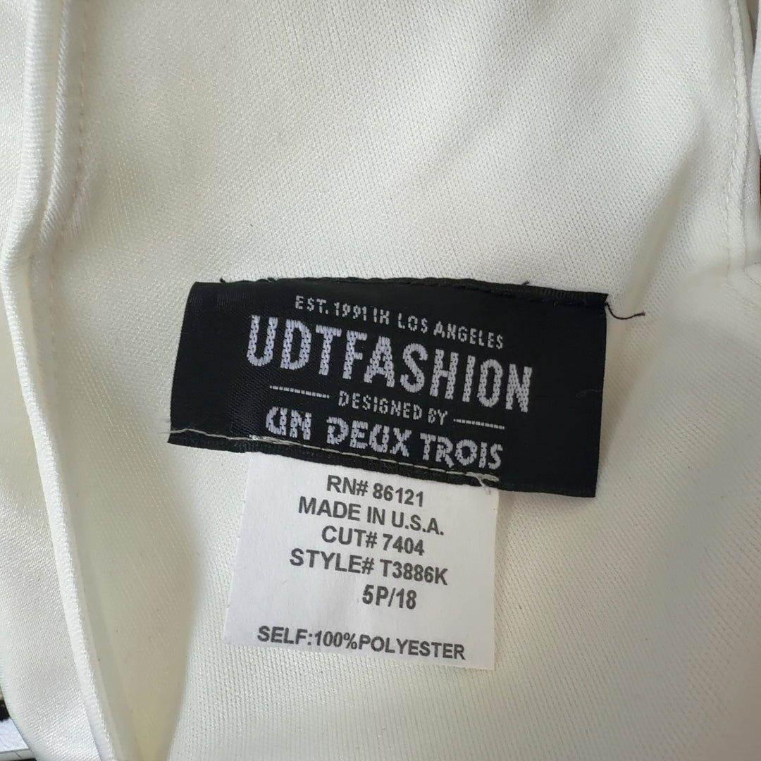 Tag view of cream sleeveless A-line midi dress showing elegant drape and silhouette