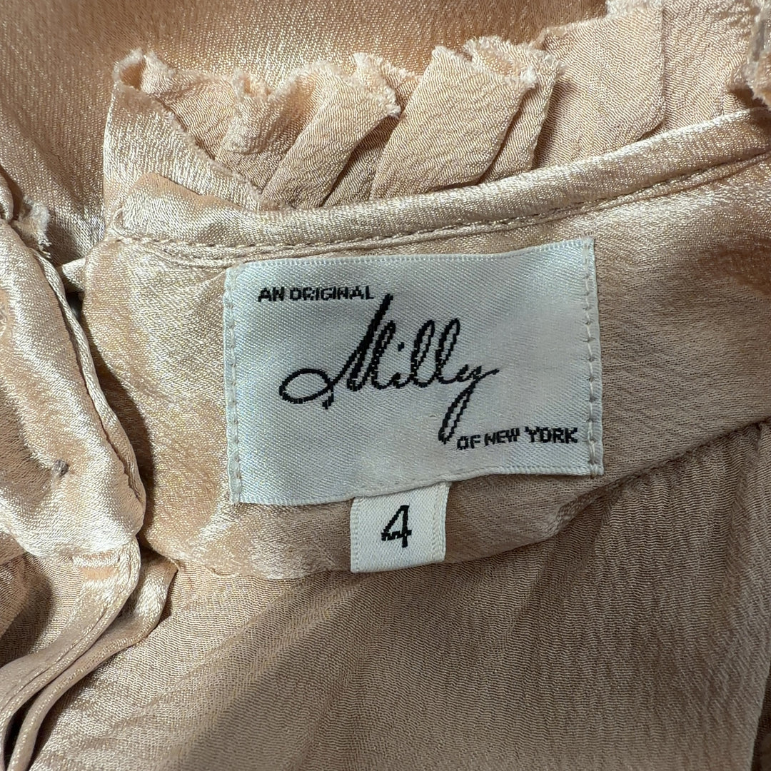 Cream sleeveless blouse with ruffled neckline by Milly, back view