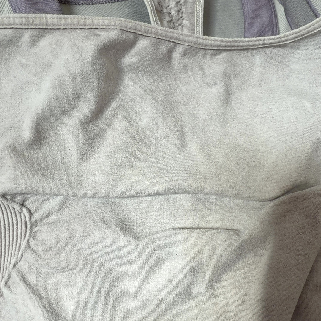 White racerback athletic tank top, back view showing supportive racerback design