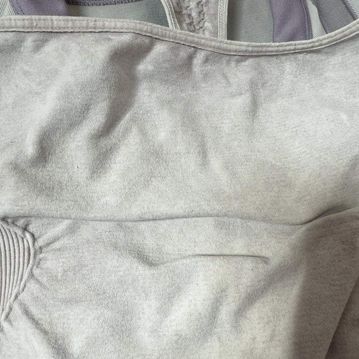 White racerback athletic tank top, back view showing supportive racerback design