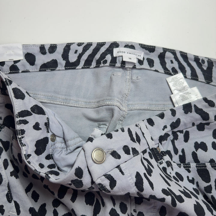 Tag view of white and black leopard print denim jeans by Good American, size XXL, showing flattering high-waisted silhouette