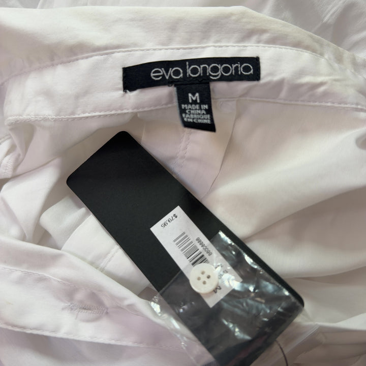 White button-up collared shirt back view, showing relaxed fit and length
