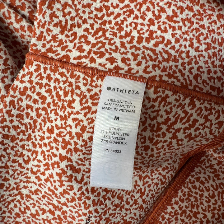 Athleta coral speckled high-waist capri leggings back view on model