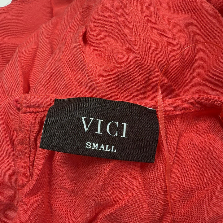 Red rayon bubble hem romper with draped back detail, back view
