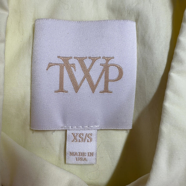 Cream cotton button-up shirt back view showing full length and relaxed silhouette