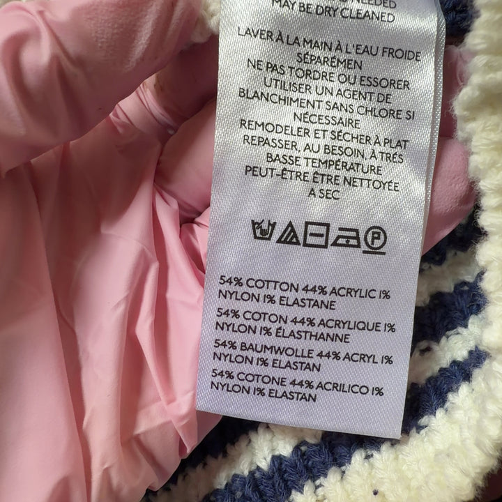 Tag view of navy striped Maeve cardigan vest showing horizontal stripe pattern and button-front design