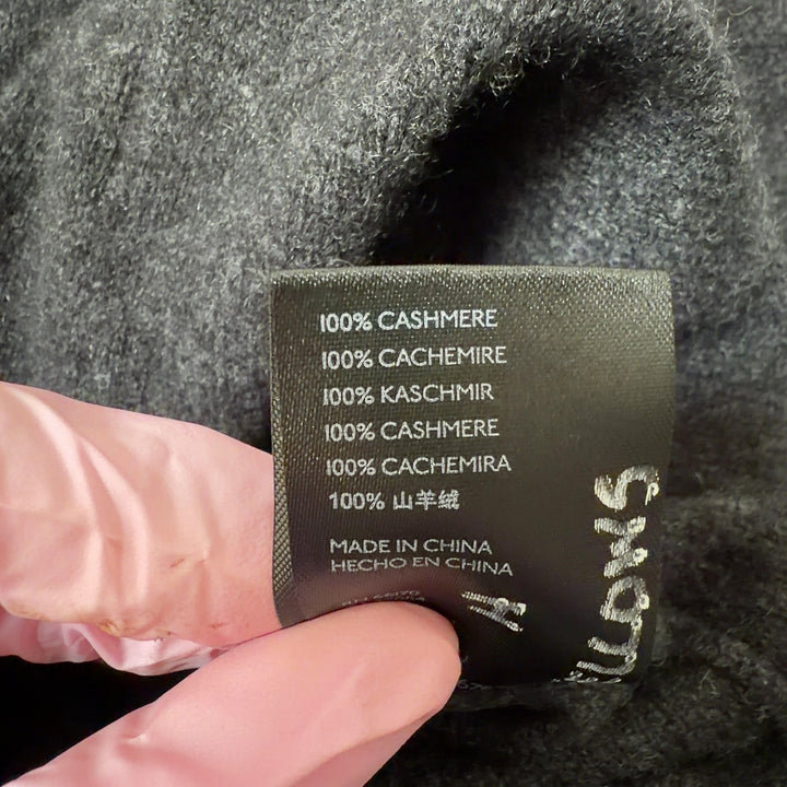 Charcoal cashmere button-front cardigan with pockets, back view showing relaxed fit and longer length