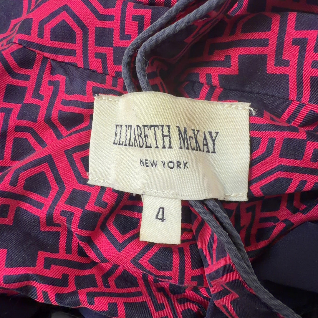 Burgundy geometric print tunic top back view, showing relaxed silhouette and flowing design
