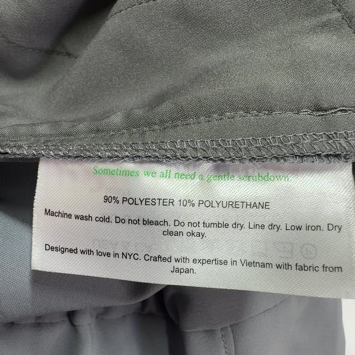 Tag view of gray tailored dress pants with elastic waistband from MM. LaFleur, size S
