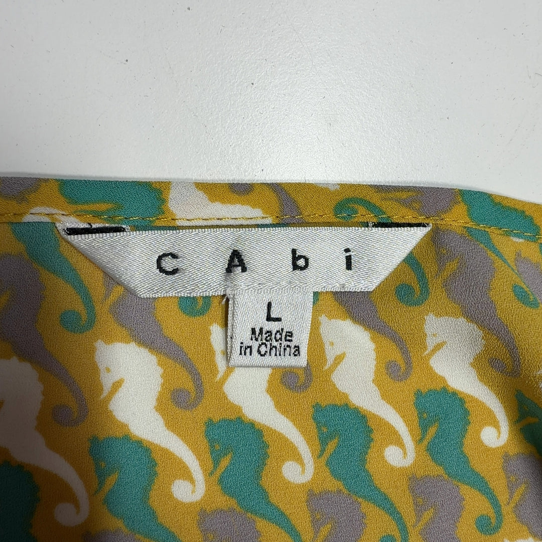 Tag view of yellow geometric print cami tank top showing relaxed A-line fit and draped silhouette