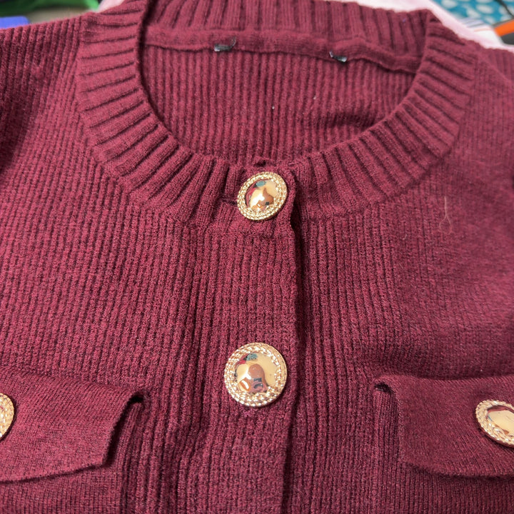 Burgundy ribbed knit cardigan back view showing button closure and cropped length