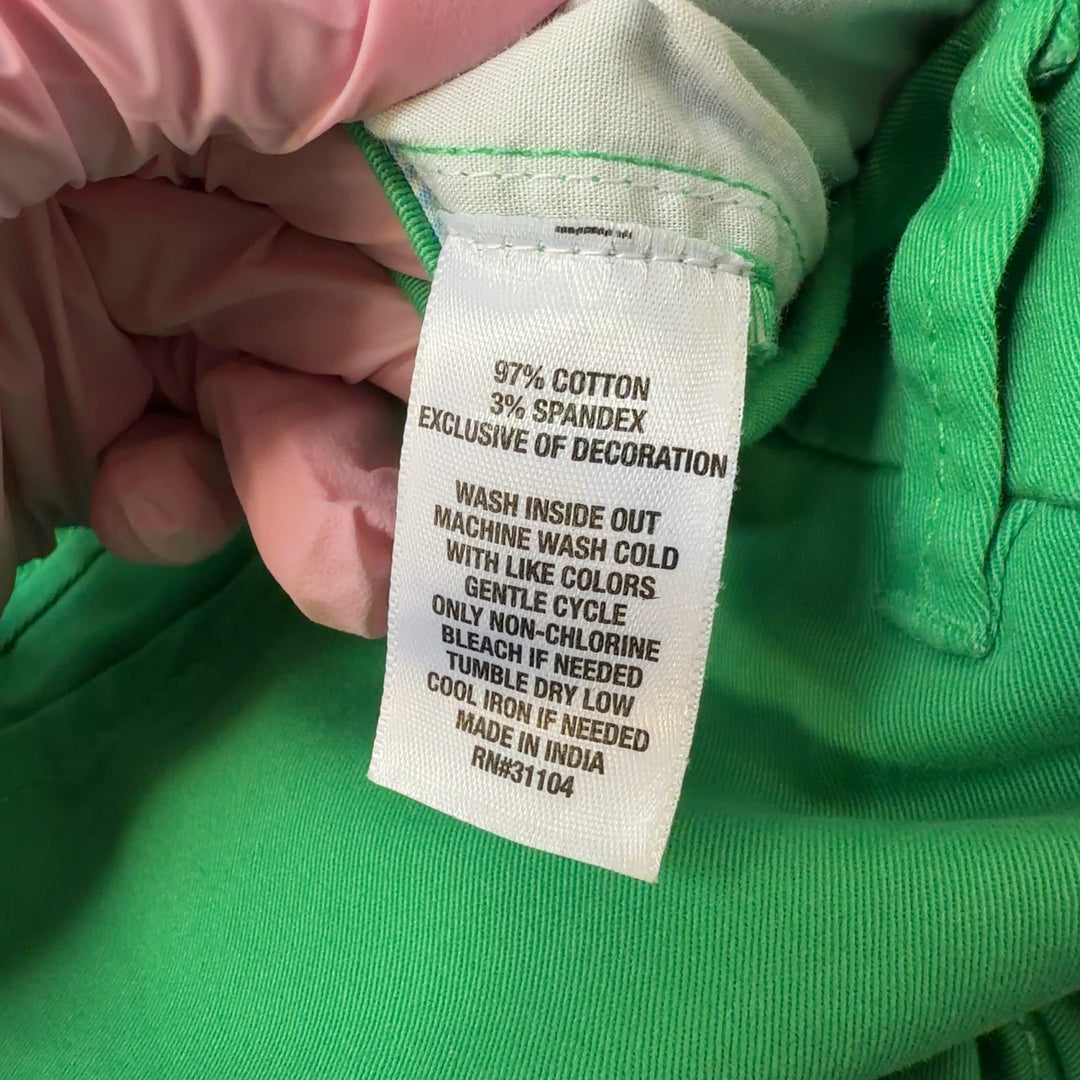 Tag view of green shorts by Crown & Ivy showing rear pockets and flattering fit on size L