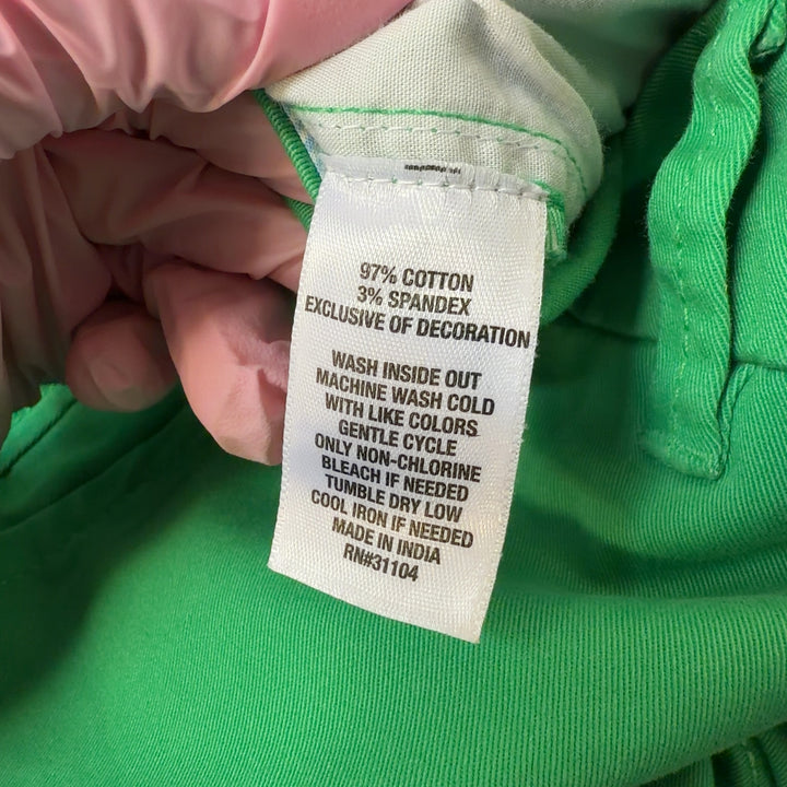 Tag view of green shorts by Crown & Ivy showing rear pockets and flattering fit on size L