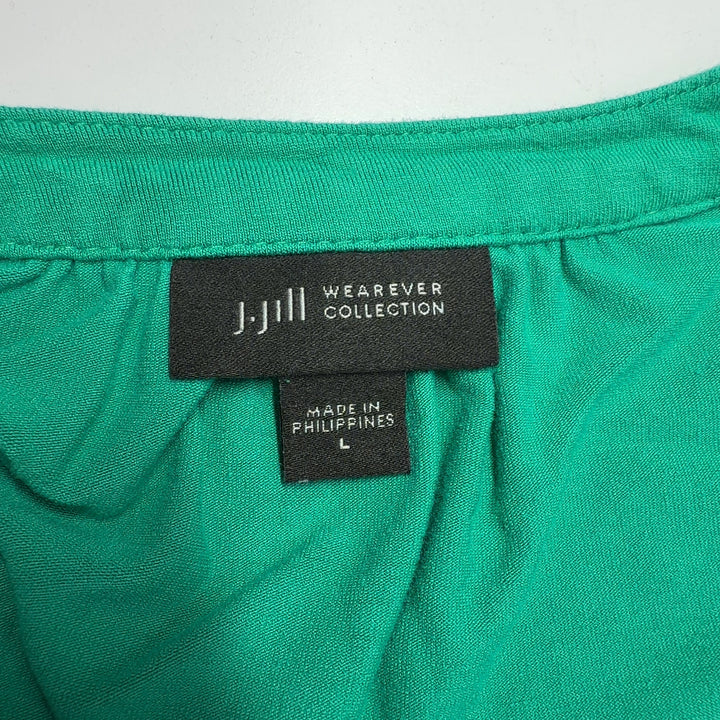 Tag view of teal rayon A-line shift dress showing relaxed fit and knee-length cut