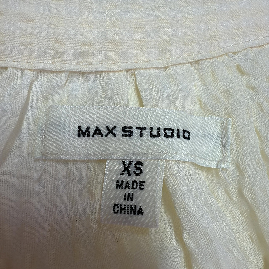 Cream collared short sleeve blouse by Max Studio, back view displaying A-line silhouette and side slit detail