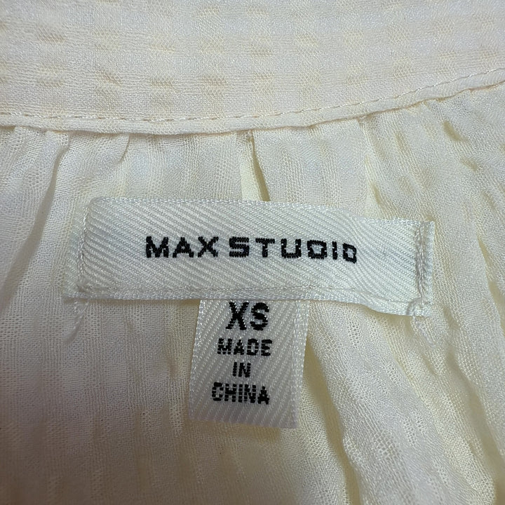 Cream collared short sleeve blouse by Max Studio, back view displaying A-line silhouette and side slit detail