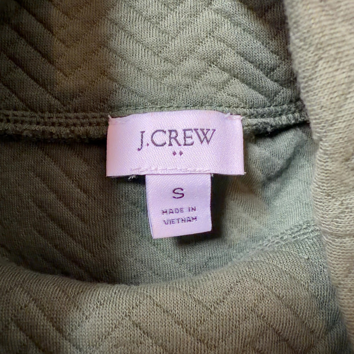 J.Crew green turtleneck pullover knit sweater back view showing button accents and cropped length