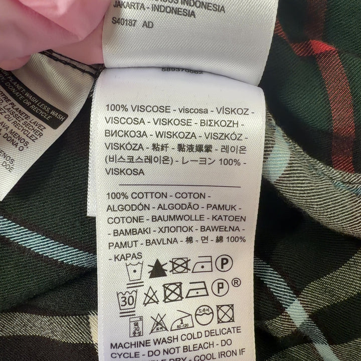 Tag view of black plaid flannel shirt showing full plaid pattern and relaxed fit silhouette