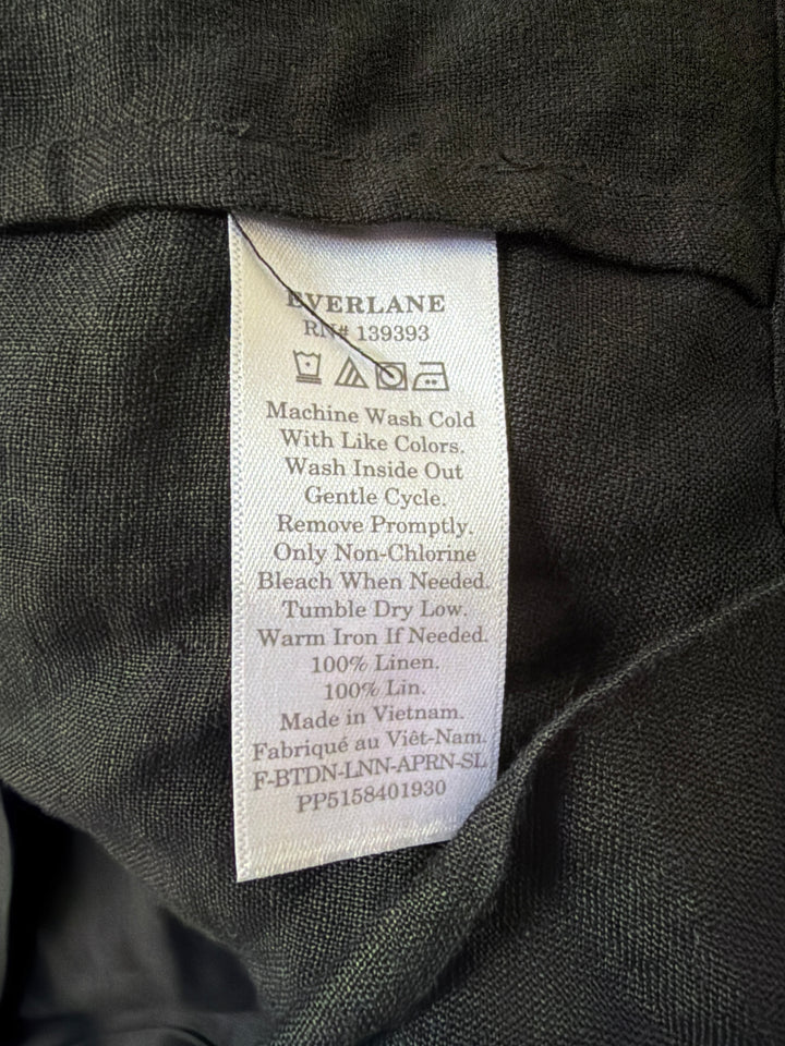 Black linen square neck tank top with button-front closure, back view