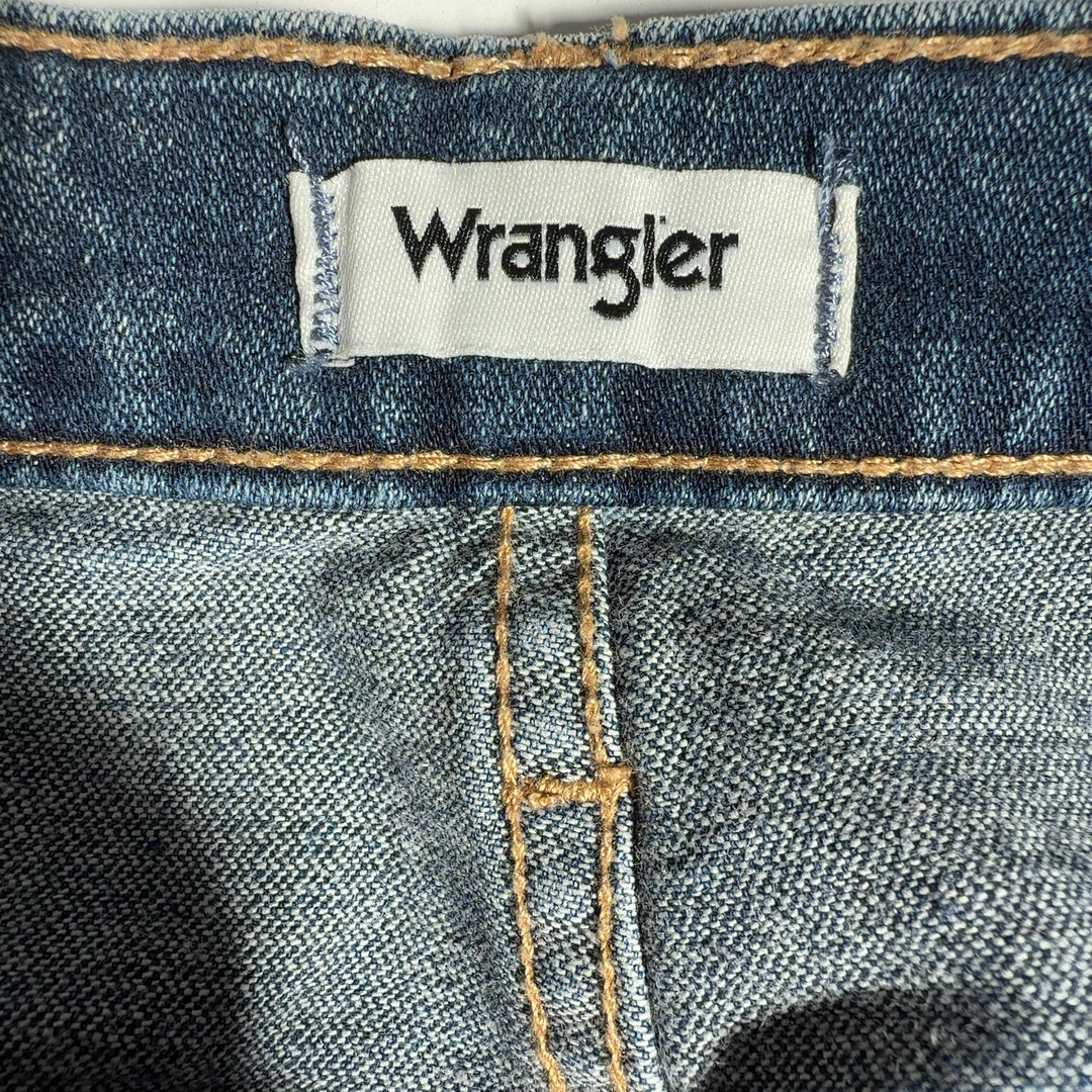 Tag view of blue Wrangler flare jeans showing classic denim construction and flared leg silhouette