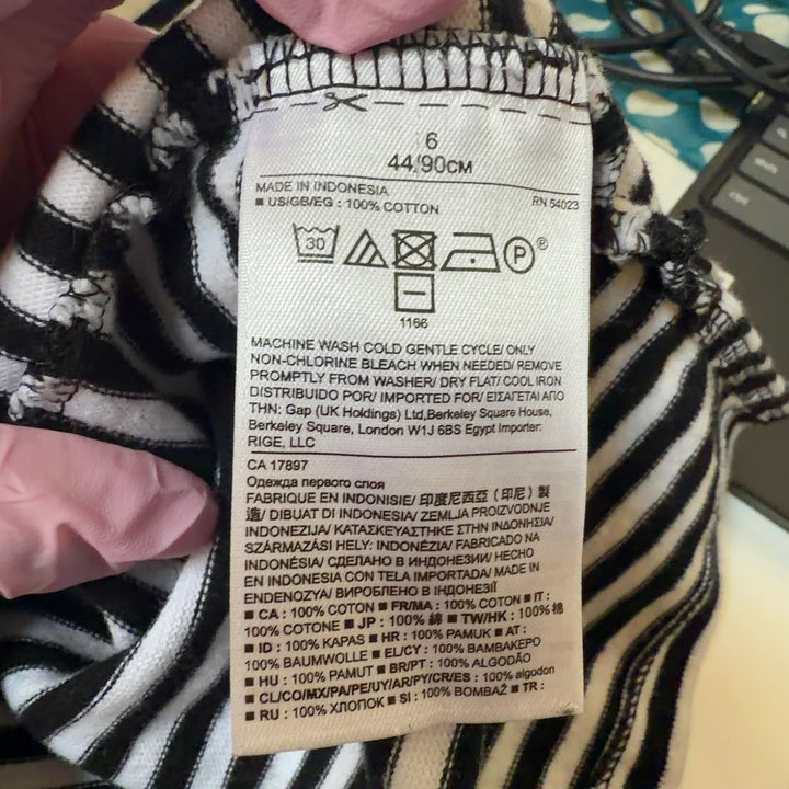 Navy and white striped sleeveless tank top, back view showing relaxed fit