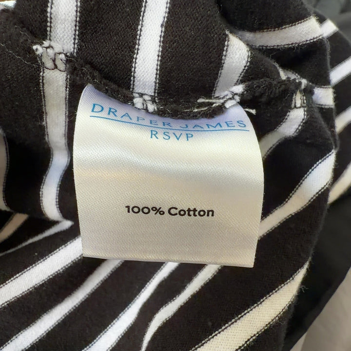 Black and white striped cotton dress back view showing relaxed A-line silhouette and sleeveless design
