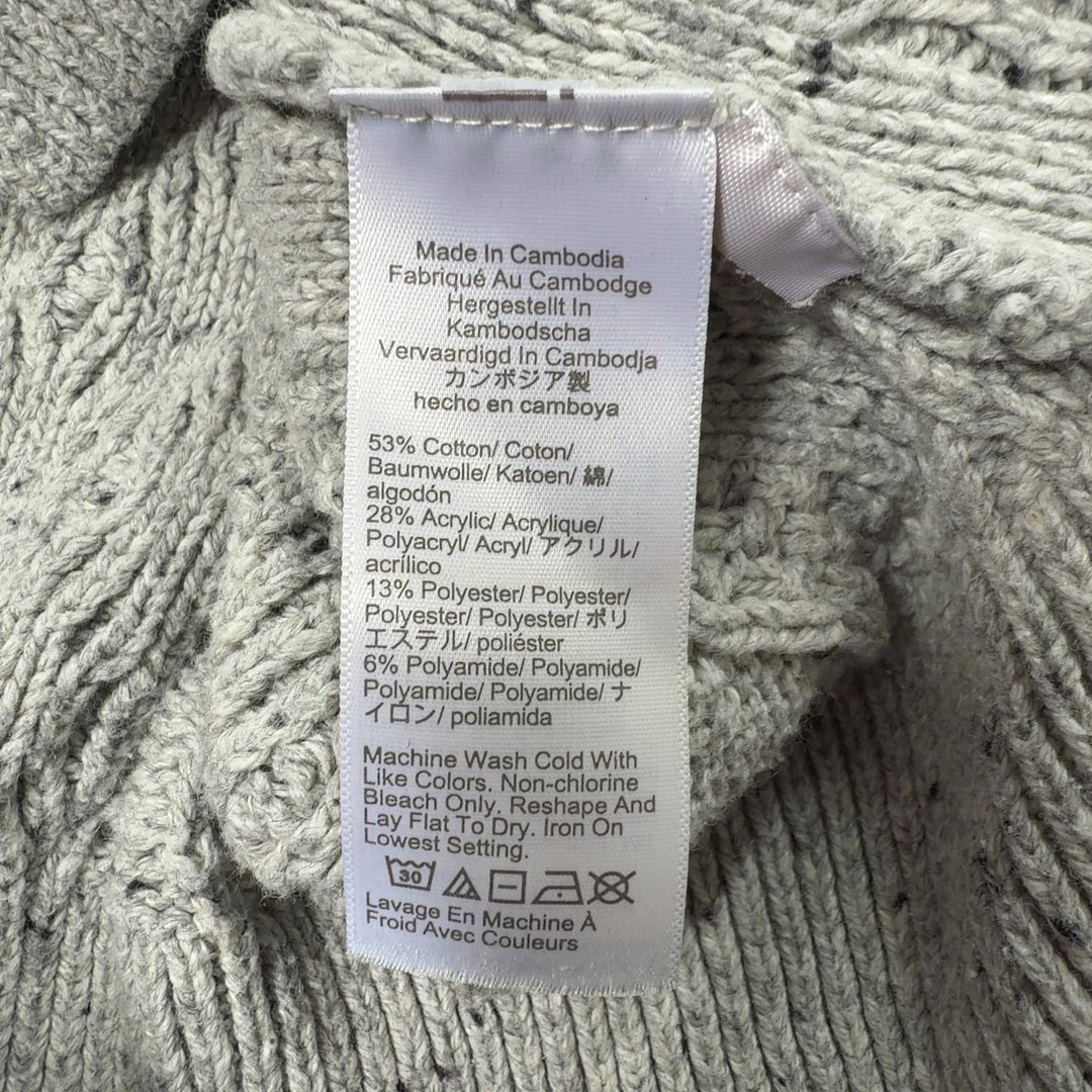 Tag view of cream cable knit pullover sweater showing textured diamond knit pattern and cropped silhouette