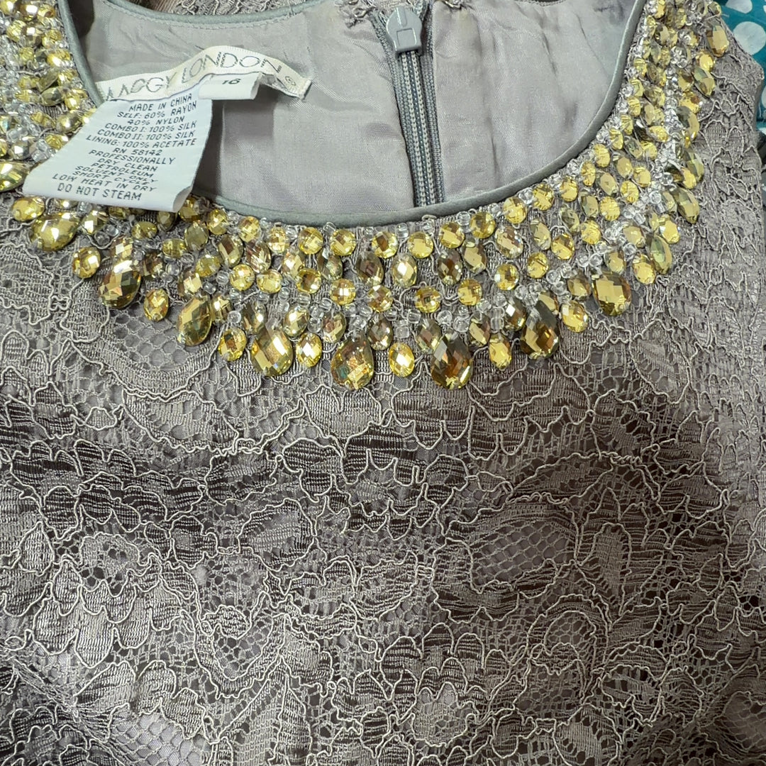 Tag view of gray lace cocktail dress showing sleeveless silhouette and textured lace pattern