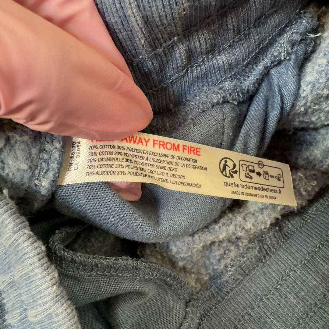 Blue denim activewear shorts with side pockets, back view on model