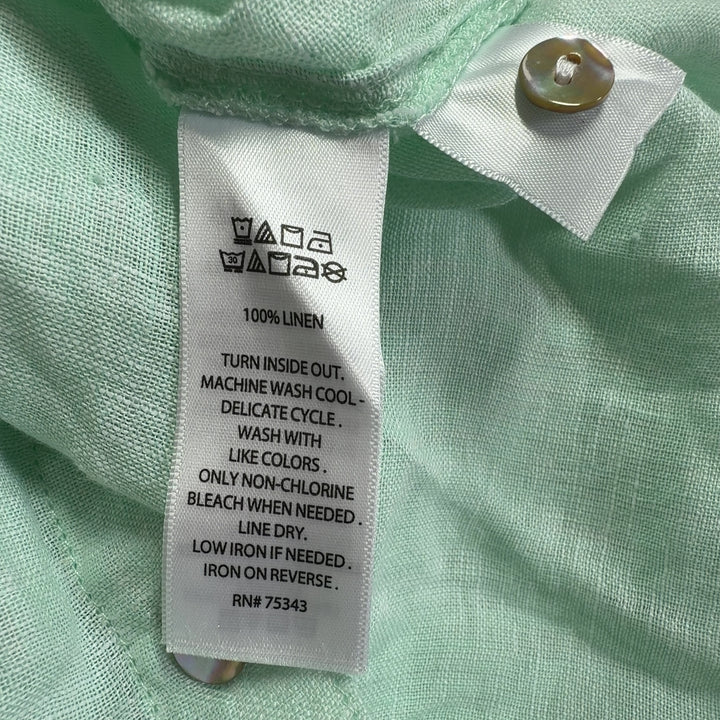 Mint green linen button-up crop shirt by Cynthia Rowley, back view displaying relaxed fit and full-length sleeves