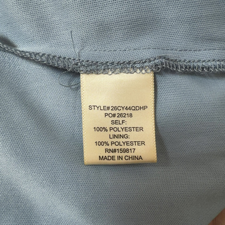 Tag view of blue tiered ruched midi dress showing layered skirt design and tie shoulder straps
