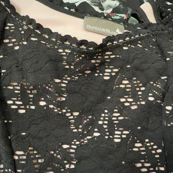 Black lace tank top with ruffle shoulders, back view showing fitted silhouette