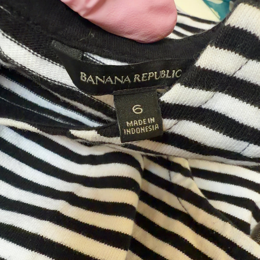 Navy and white striped sleeveless tank top, back view showing relaxed fit