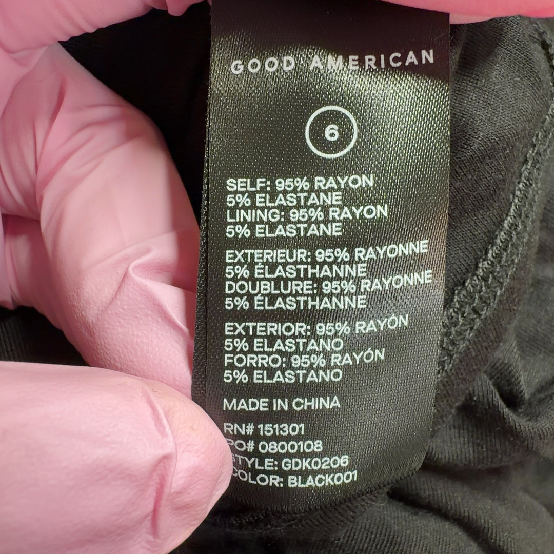 Black strapless ruched maxi dress by Good American, back view displaying the sophisticated ruched design and maxi length