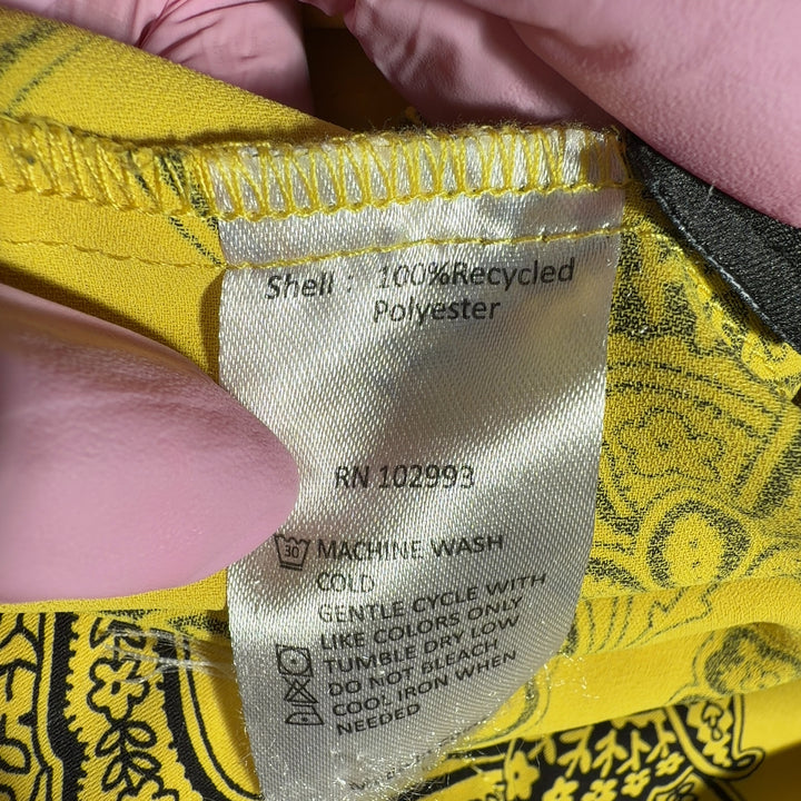 Yellow floral button-up blouse with botanical print, back view showing relaxed fit