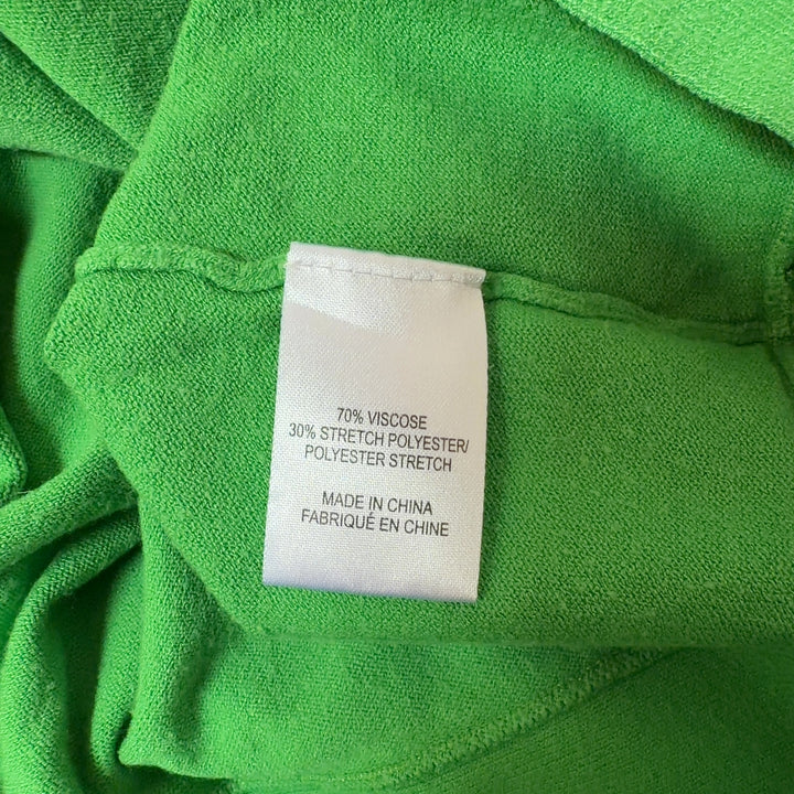 Green viscose knit top with ruffle detail, back view showing fitted silhouette