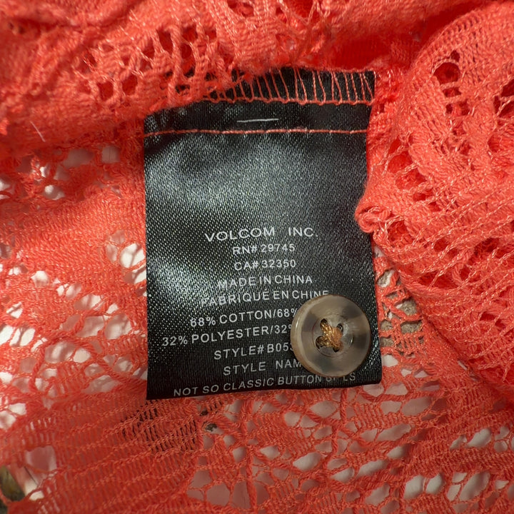 Orange lace button-up shirt back view showing lace detailing and button closure